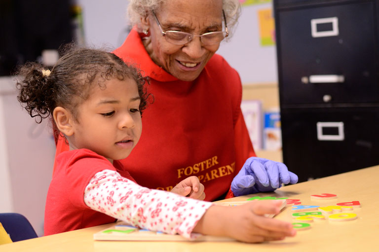 Foster Grandparent helping Student