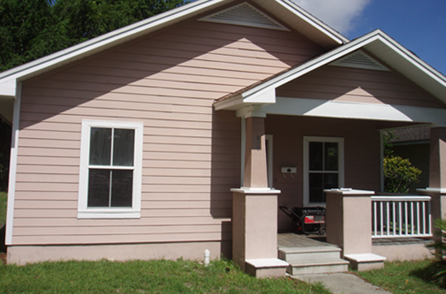 Tan One Story House with White Trim