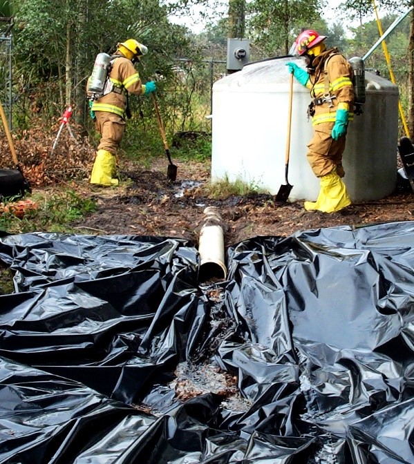 Firefighters cleaning up a spill
