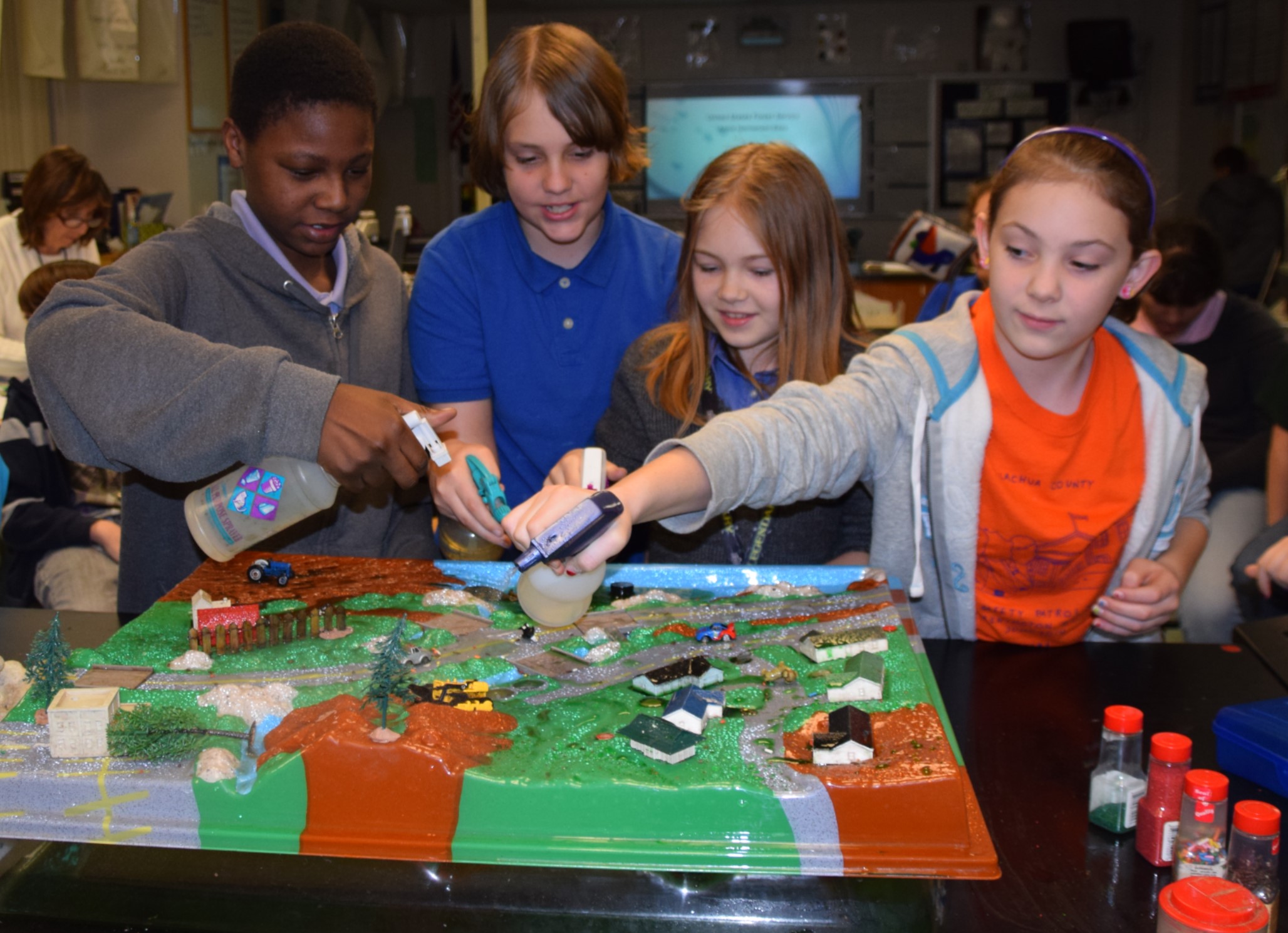 Children using the Enviroscape desktop model