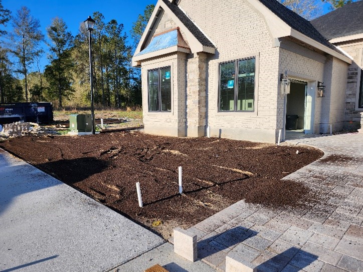Home with soil in front lawn